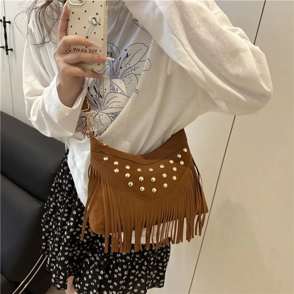 Vintage Korean-style shoulder bag with metal rivets, bohemian design, by Corporación Turística, featuring textured leather details.