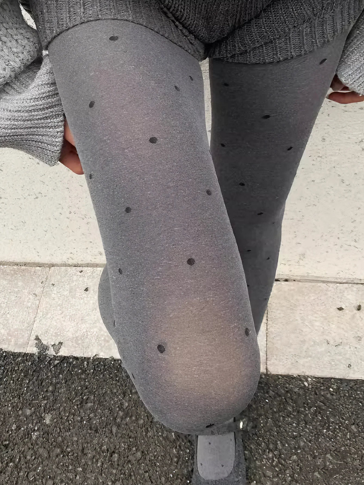 Gray vintage knit tights with small dotted pattern, designed by Corporación Turística, shown on a model.