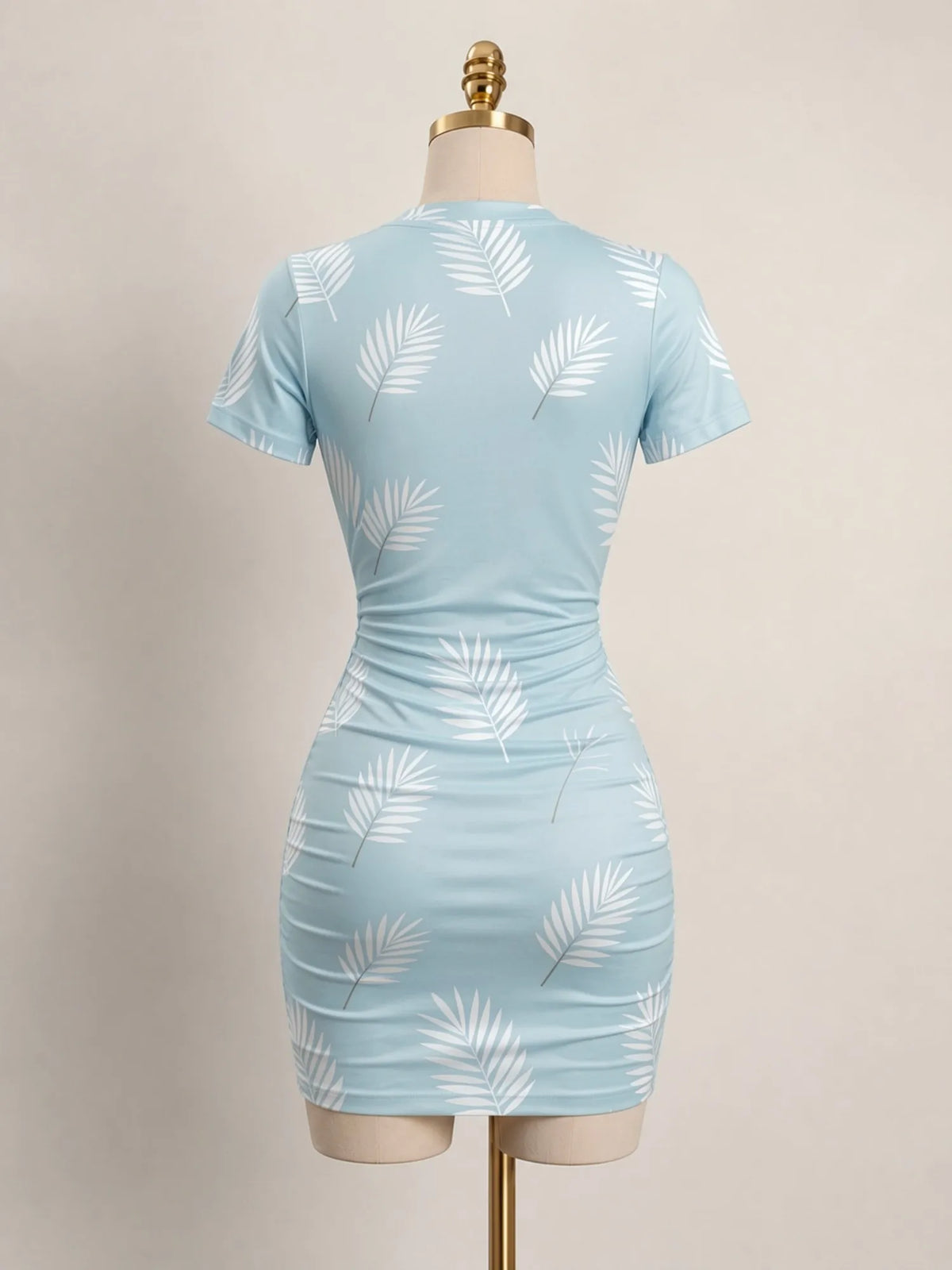 Close-up of a fitted women's mini dress with short sleeves and a high neckline, from Corporación Turística.