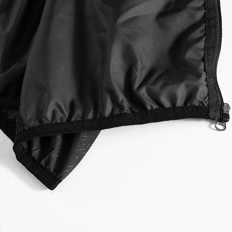 Unisex waterproof hiking jacket by Corporación Turística, lightweight outdoor jacket with protective features, shown in dark color.