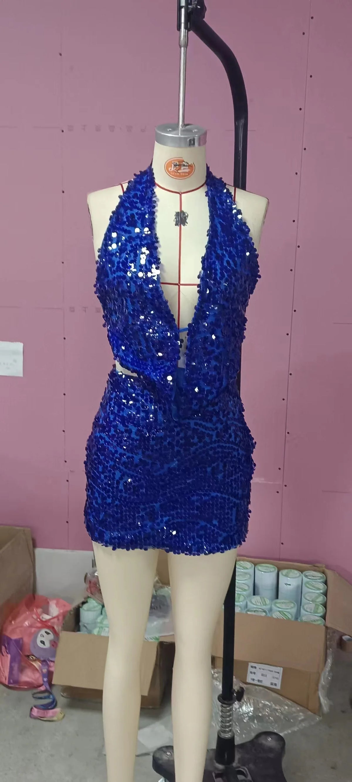 Two-piece sexy sequin outfit with a sleeveless top, featuring shimmering gold and silver sequins, perfect for glamorous occasions.