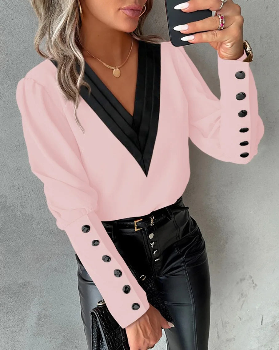 Women’s office blouse with V-neck and buttons, featuring a professional fit and stylish design, by Corporación Turística.