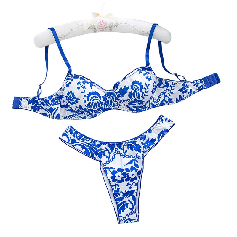 Blue floral print women's lingerie set featuring matching bra and panties, soft fabric with delicate floral pattern.
