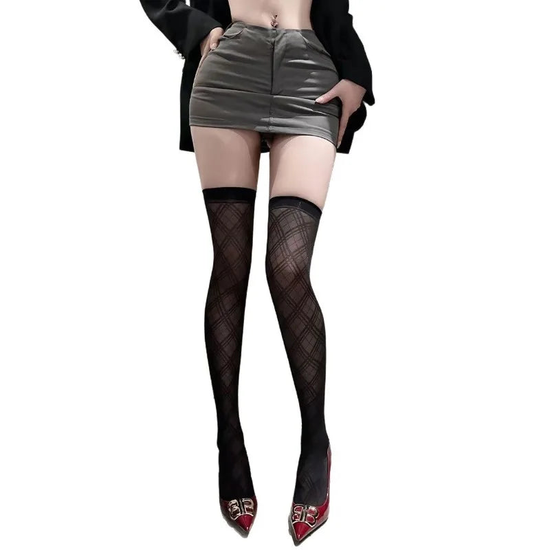 Pair of elegant minimalist silk socks from Corporación Turística, showcasing smooth, shiny fabric and sleek design.