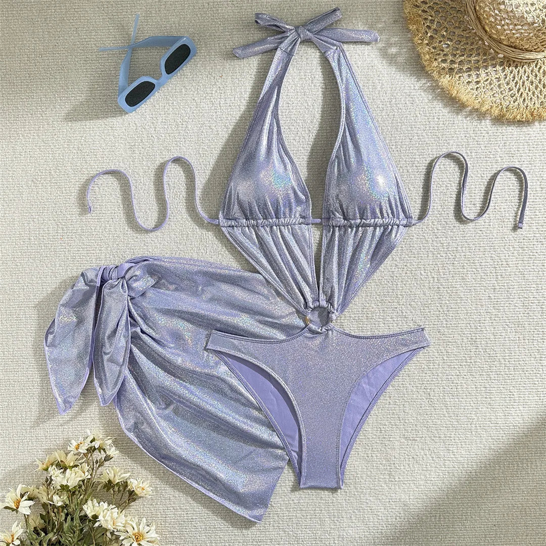 Sparkling glitter con sarong with deep V neckline, perfect for beach or poolside wear, by Corporación Turística.