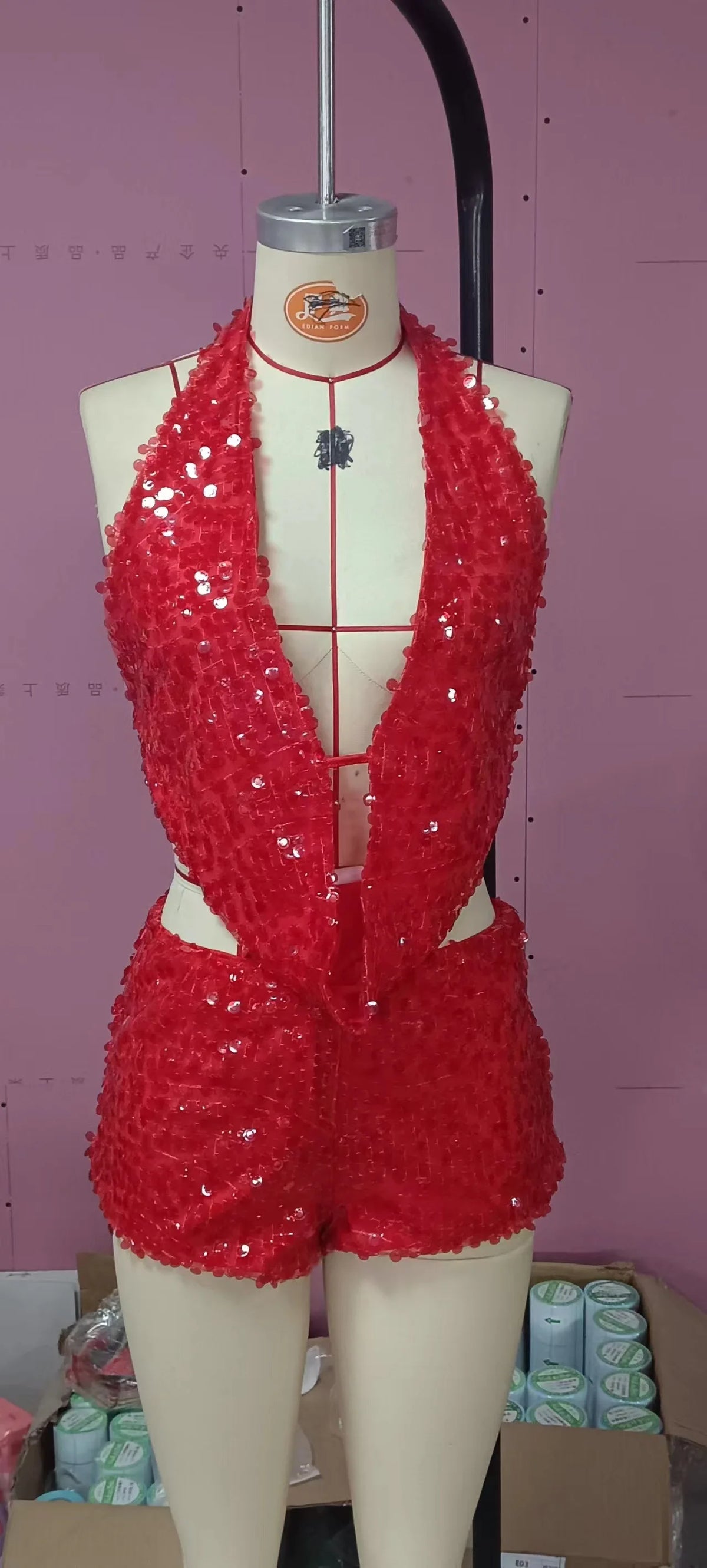 Two-piece sexy sequin crop top and skirt set by Corporación Turística, sleeveless top with shimmering embellishments.