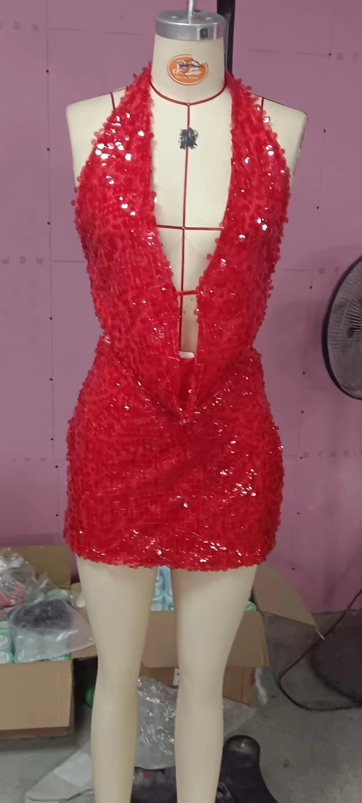 Two-piece sexy sequin set with sleeveless top, featuring shiny embellishments, designed for stylish evening wear.