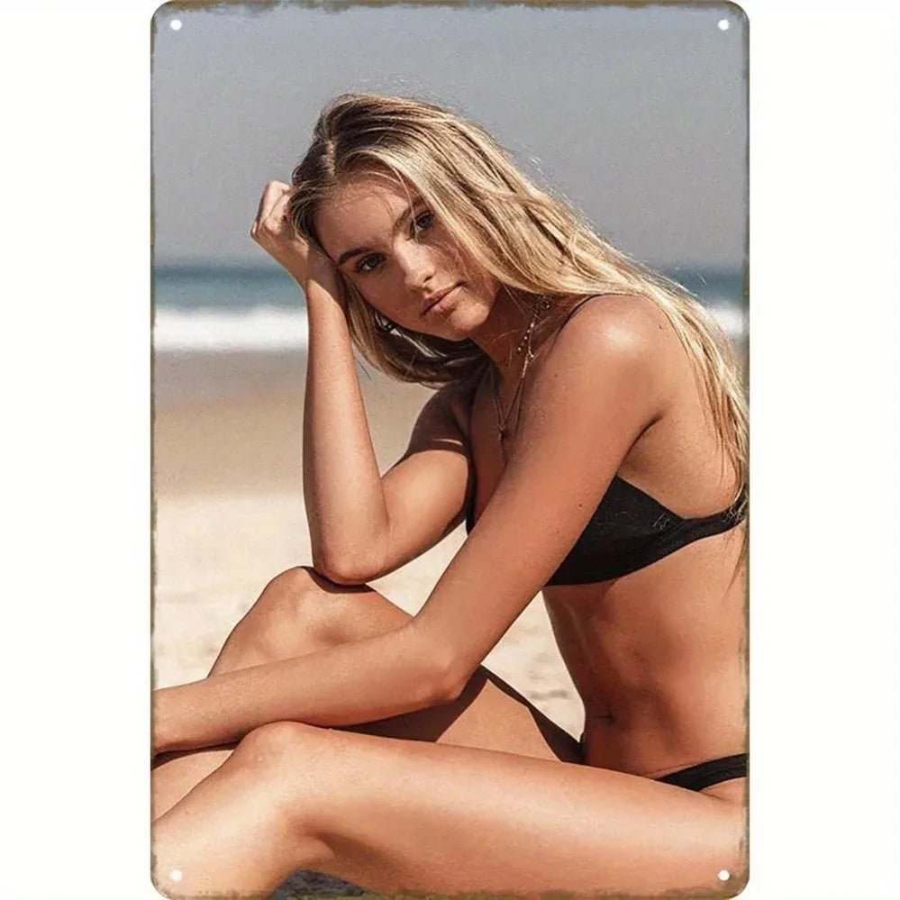 Vintage metal wall decor featuring a beach girl design, perfect for seaside-themed interior decoration.