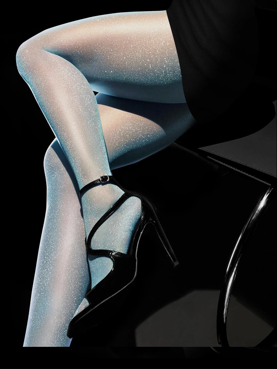 Pair of shiny, transparent nude-colored Kave stockings from Corporación Turística, showcasing smooth, glossy, and sexy sheer design.