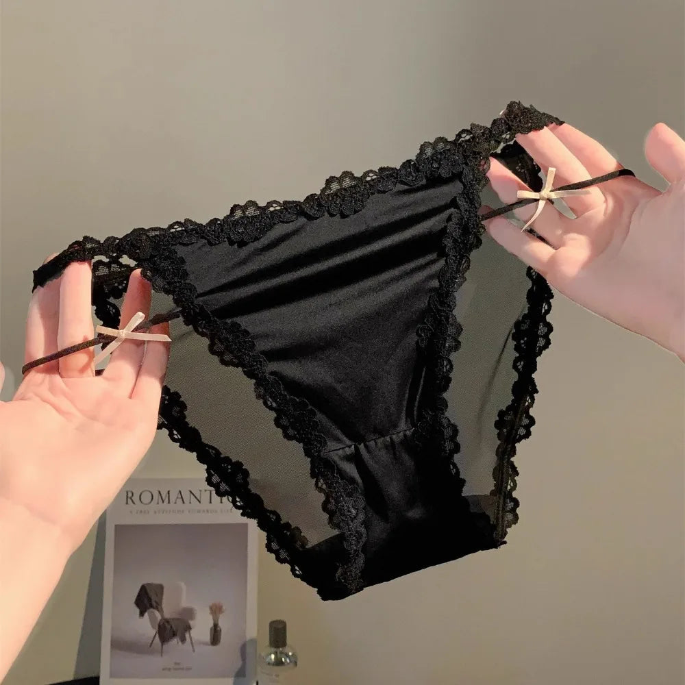 Delicate lace panties from Corporación Turística featuring a sweet, fine design with a hollow pattern, on a neutral background.