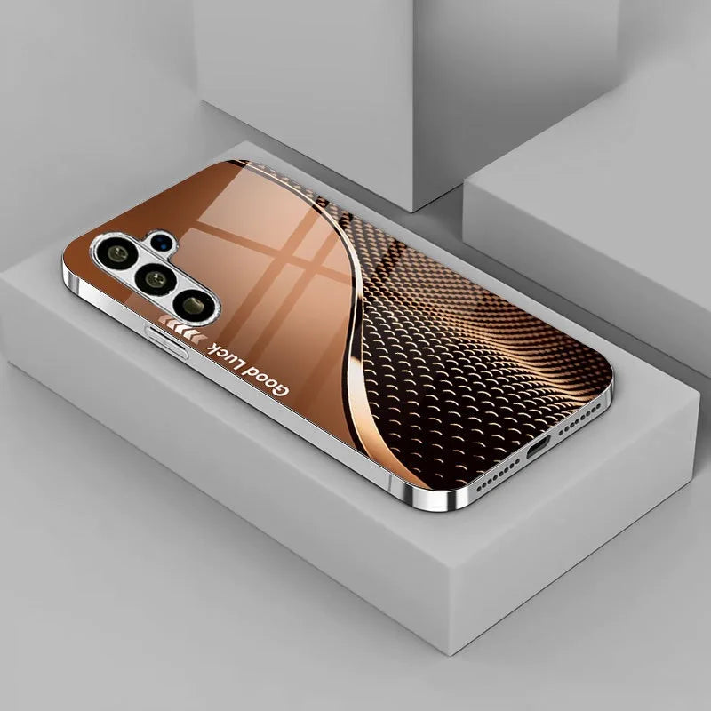 Electroplated glass phone case with decorative design, compatible with various smartphones, by Corporación Turística.