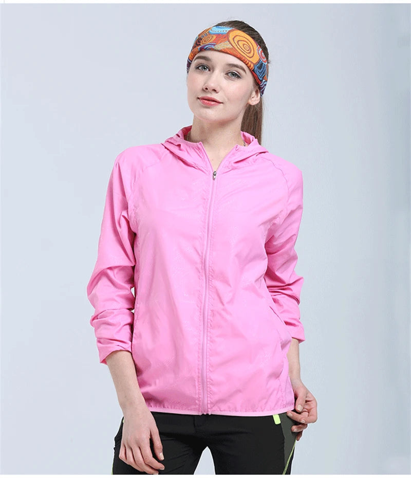 Waterproof camping rain jacket for men and women by Corporación Turística, windproof outdoor raincoat with adjustable hood.