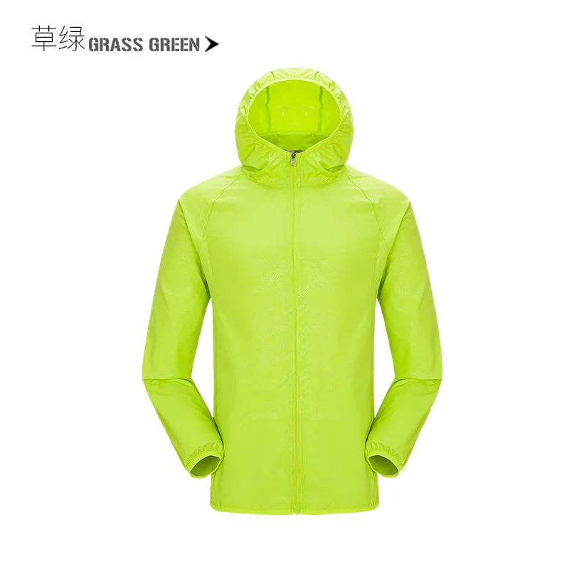 Waterproof camping rain jacket for men and women by Corporación Turística, shown in a vibrant outdoor setting.