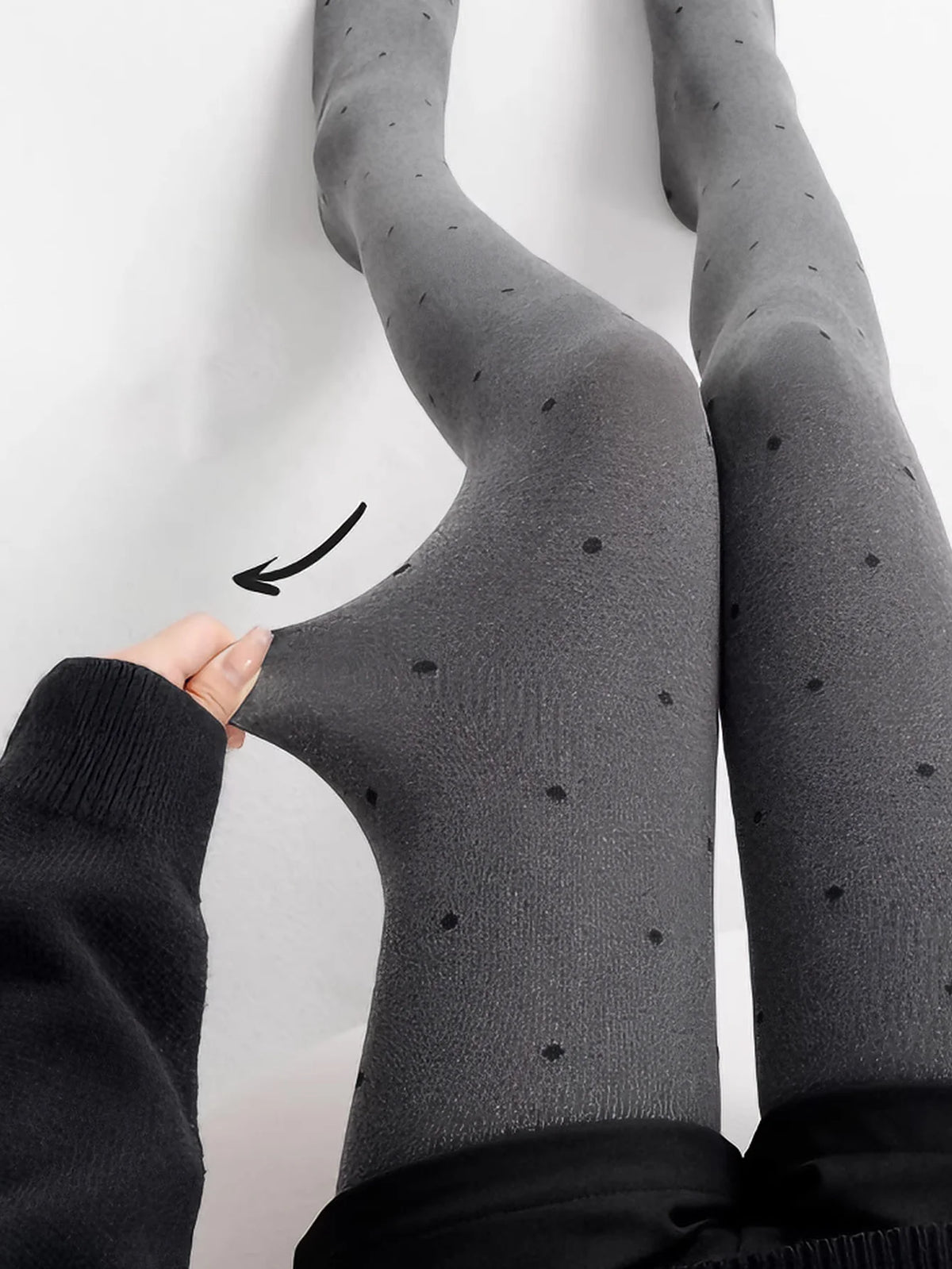 Gray vintage knit tights with small polka dot pattern, designed by Corporación Turística, shown in a close-up image.