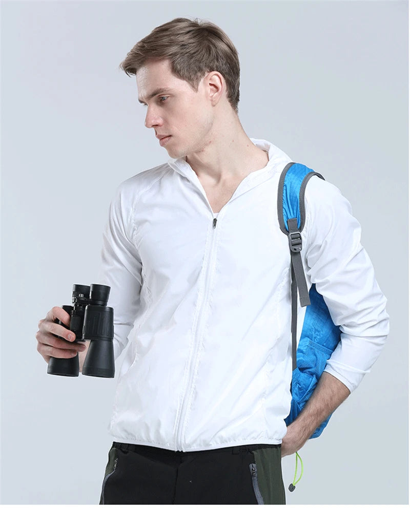 Lightweight camping rain jacket for men and women by Corporación Turística, waterproof outdoor raincoat with hood and adjustable fit.