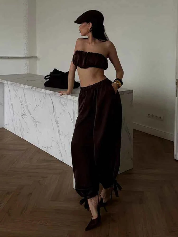 Elegant women's two-piece set by Chin.Sweety featuring a pleated top and elastic pants, perfect for festive occasions.