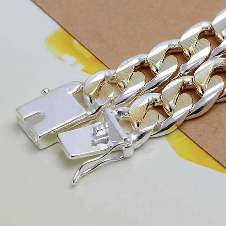 Solid sterling silver chain bracelet from Corporación Turística with 8/10mm links, stylish and durable jewelry accessory.