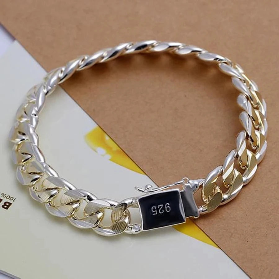 Solid sterling silver chain bracelet from Corporación Turística with 8-10mm links, showcasing a sleek, polished design.