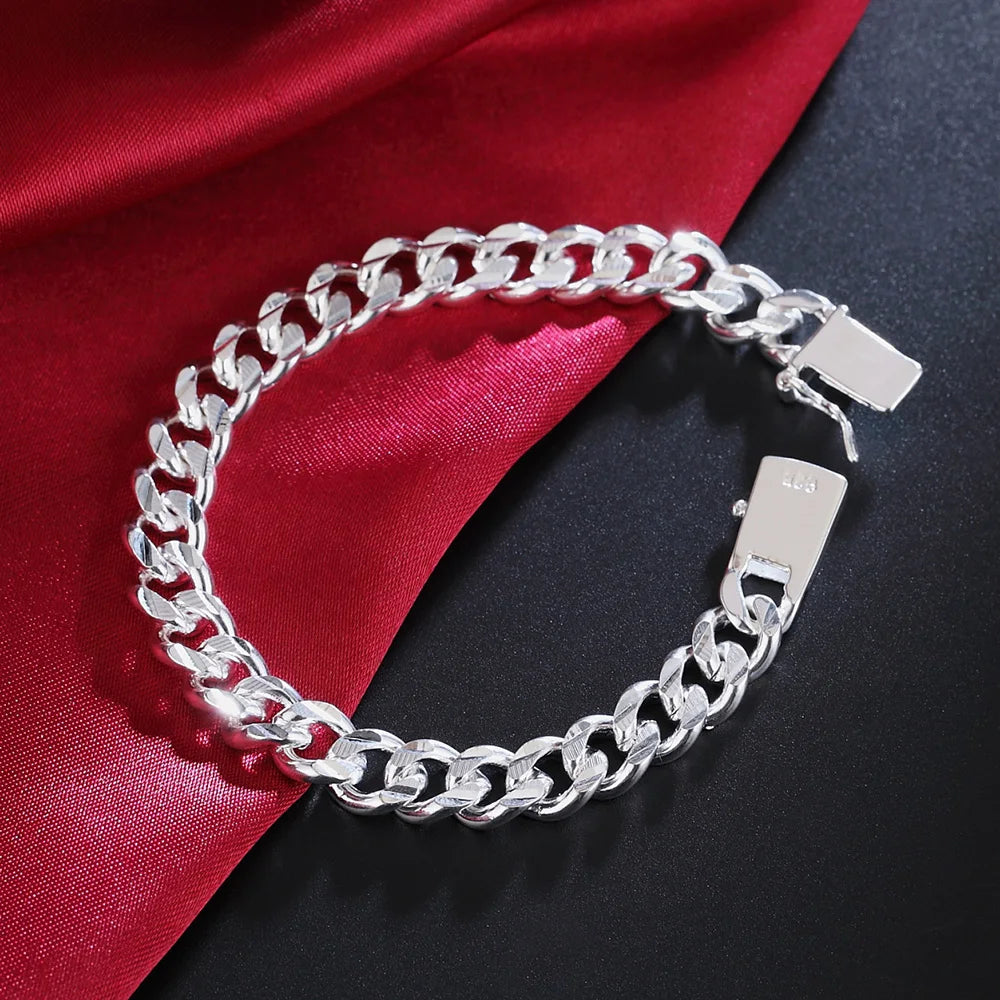 Solid sterling silver chain bracelet from Corporación Turística with 8/10mm links, showcasing a sleek and durable design.
