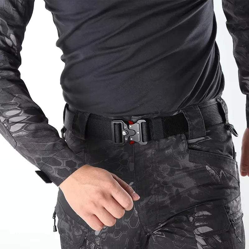 Black Paul Hueman tactical belt with adjustable length, unisex design, featuring durable nylon strap and metal buckle.