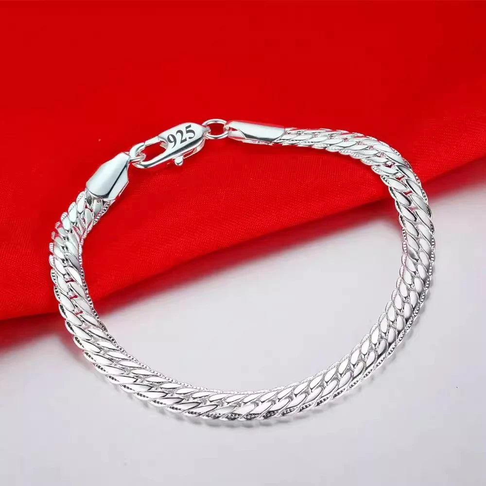 Silver 925 bracelets for women and men featuring sleek, polished designs from Corporación Turística.