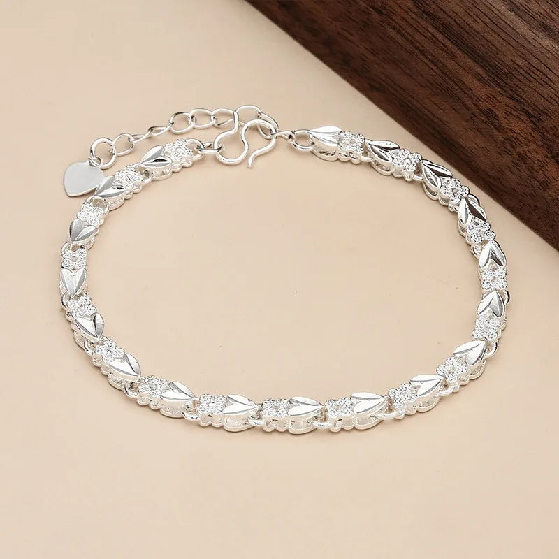 Silver 925 bracelets for women and men, featuring sleek designs and polished finishes, perfect for casual or formal wear.