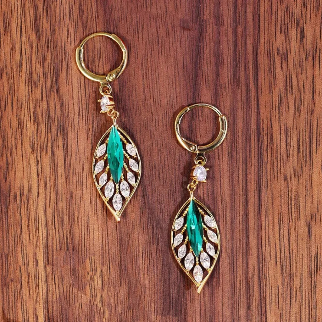 Green zircon leaf drop earrings for women, featuring elegant silver hooks and intricate leaf design, by Corporación Turística.