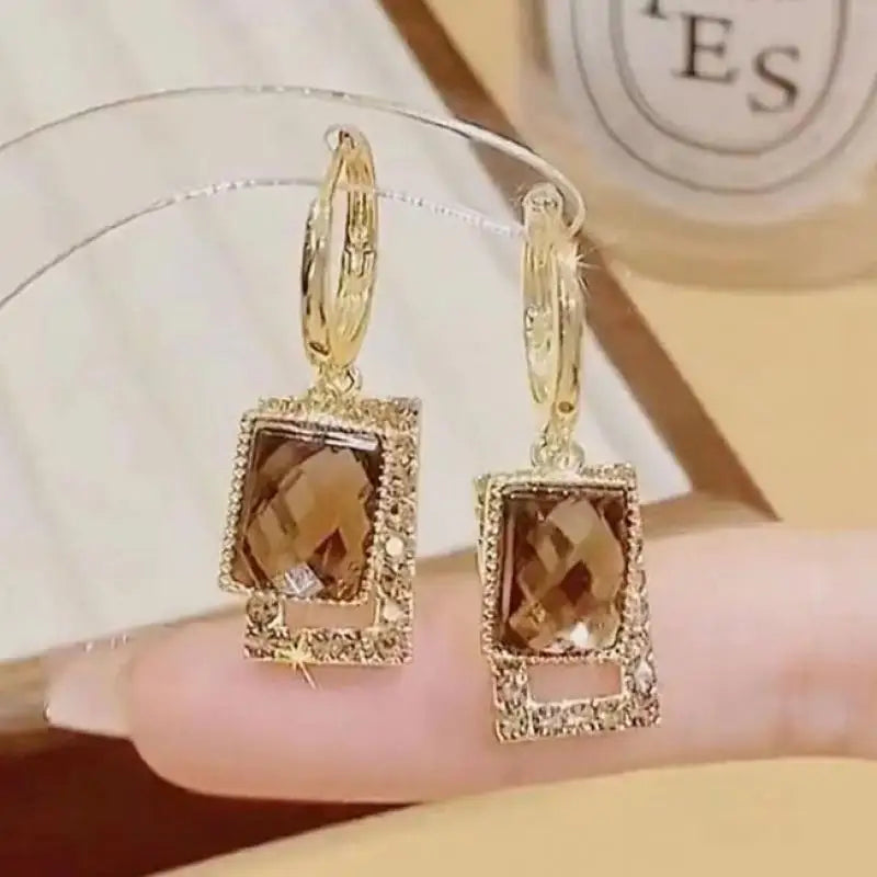 Silver 925 drop earrings with cubic zirconia teardrop design, featuring needle-style hooks for a stylish look.