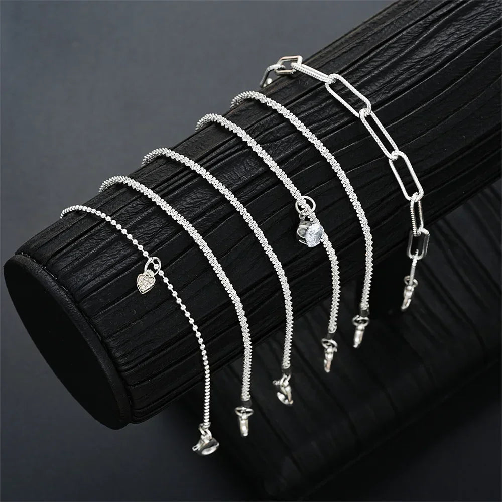 Six imitation diamond silver bracelets from Corporación Turística, featuring sparkling cubic zirconia accents on sterling silver bands.