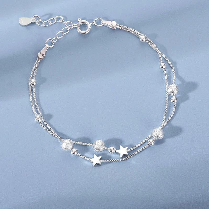 Six imitation diamond silver bracelets featuring shiny, elegant designs, perfect for stylish accessories.