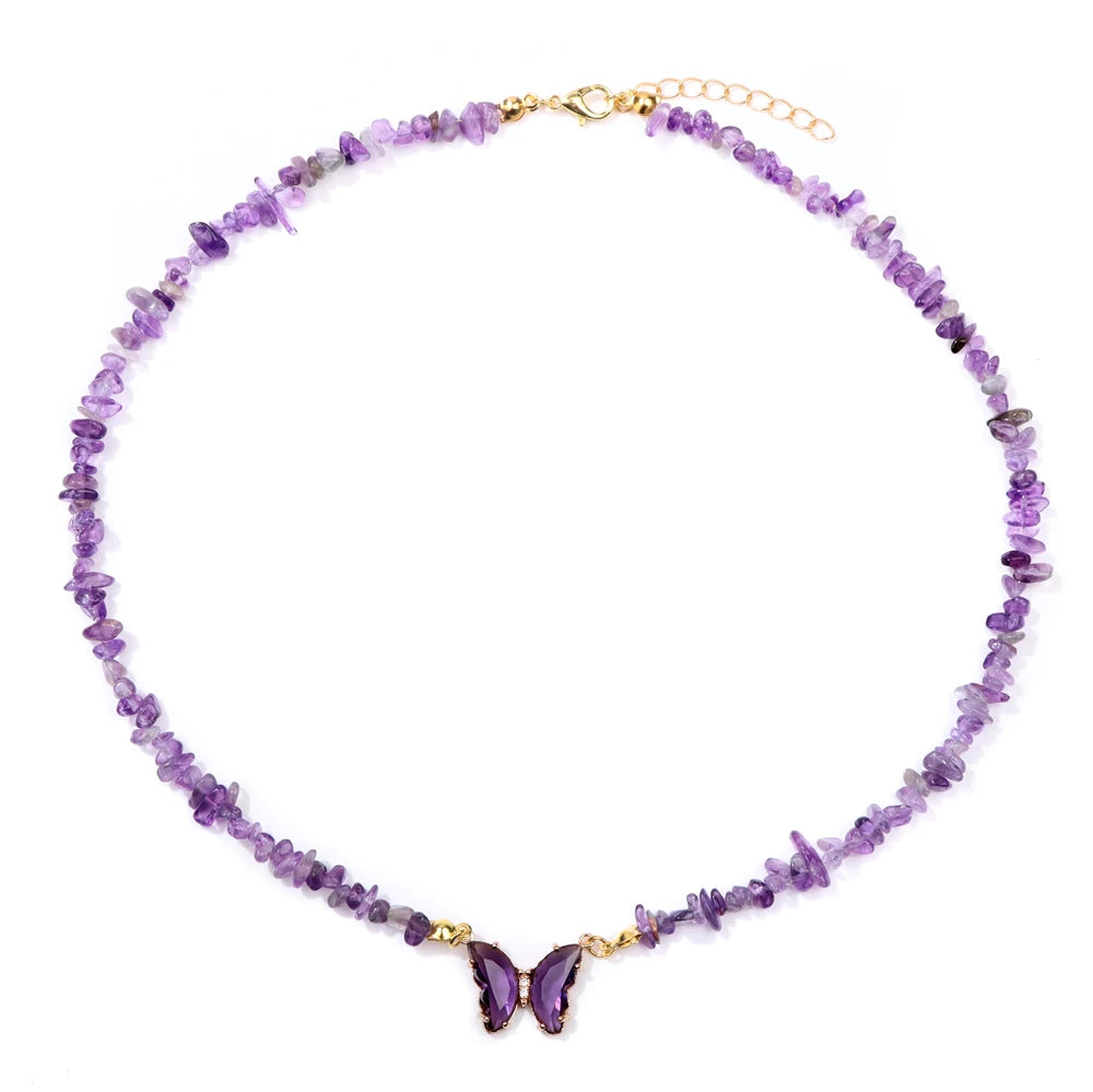 Fashion butterfly crystal collar with purple amethyst stones, stylish jewelry by Corporación Turística, close-up view of the necklace.