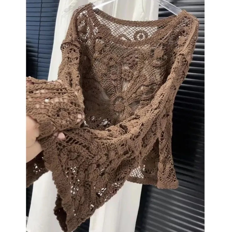 Lightweight summer knitted sweater for women by Corporación Turística, featuring a delicate open-knit design in soft fabric.
