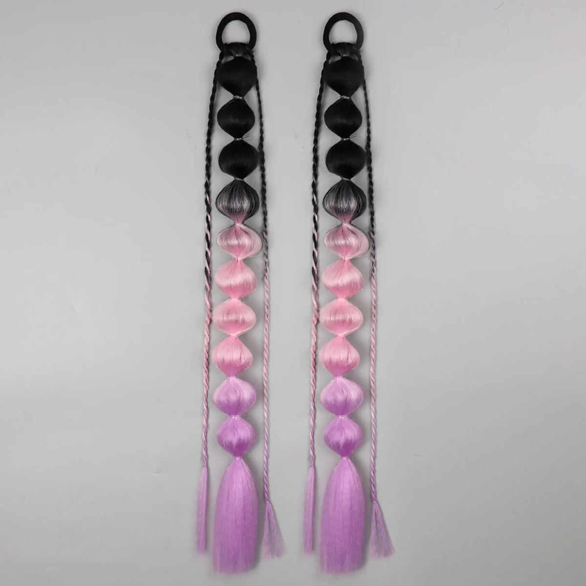 Synthetic bubble ponytail extensions from Corporación Turística, showing long, shiny, and curly synthetic hair for a stylish hairstyle.