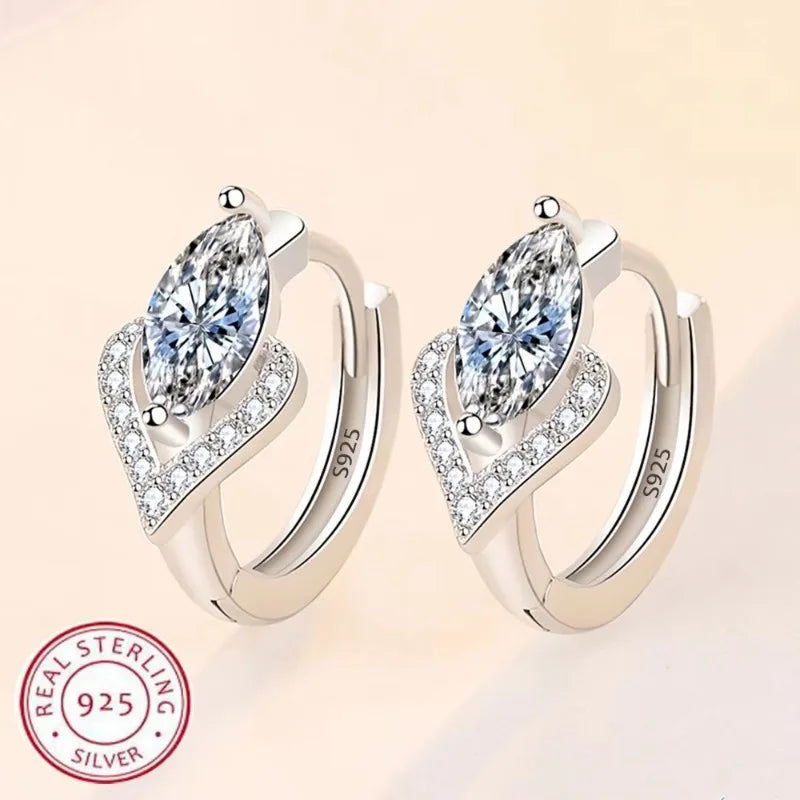 Fashion C-shaped clip-on earrings for women, stylish and modern jewelry by Corporación Turística, shown in silver tone.