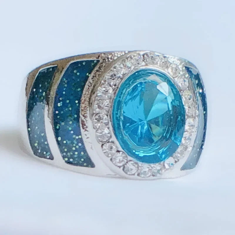 Oval-shaped sterling silver ring with 1ct 5A cubic zirconia, luxury design from Corporación Turística, showcasing intricate craftsmanship.