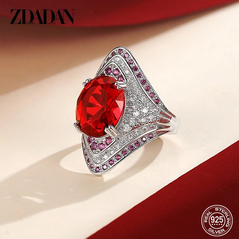 Sterling silver 925 ring with a ruby for women, featuring a polished band and a prominent ruby gemstone.