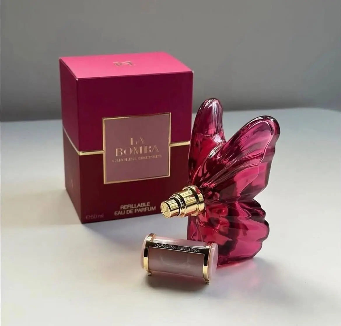 Feminine LA Bom perfume by Corporación Turística, 2.7oz bottle with floral fragrance, elegant packaging and design.