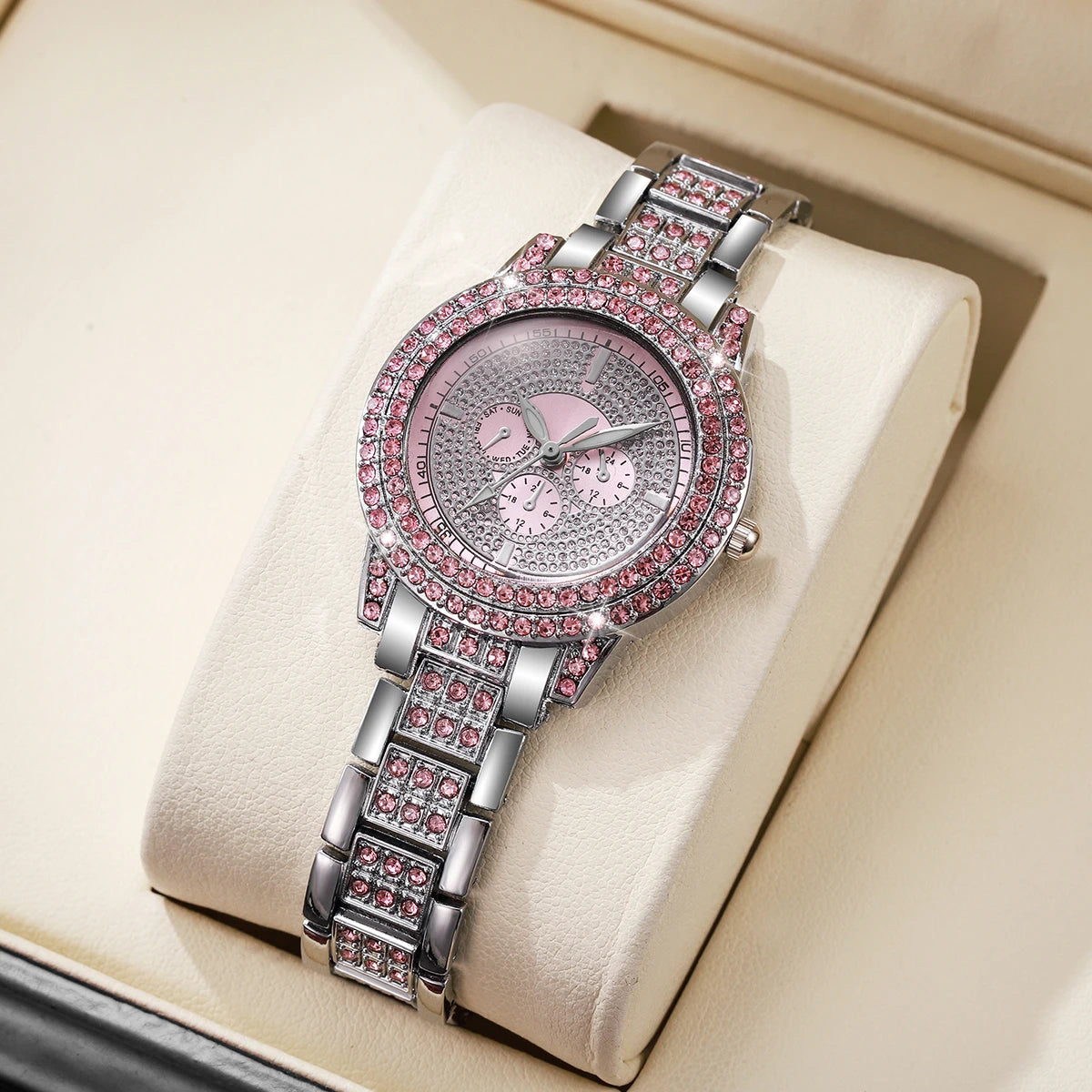 Pink luxury watch with imitation diamonds for women, featuring a sleek design and elegant style from Corporación Turística.