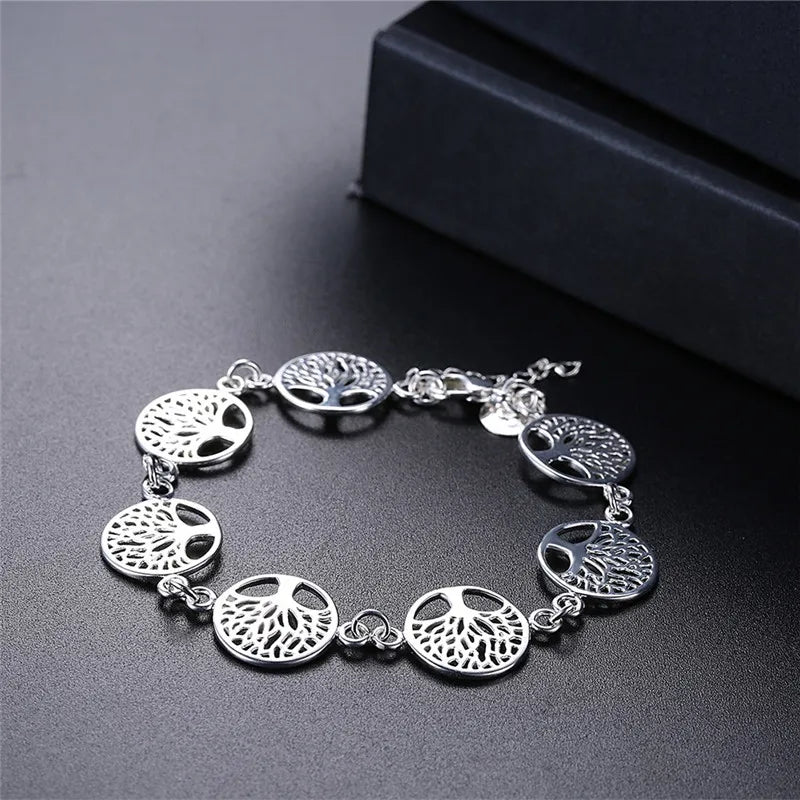 Silver 925 bracelet with intricate tree flower designs, showcasing detailed floral patterns on a delicate jewelry piece.