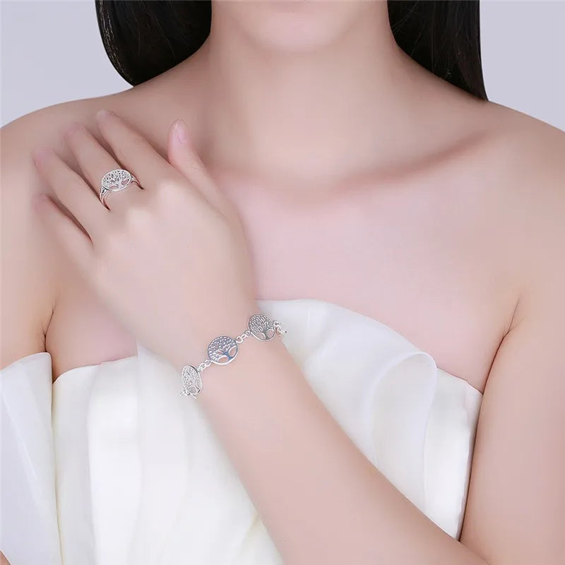 Silver 925 bracelet with delicate tree flower designs, featuring intricate floral details on a slim chain.