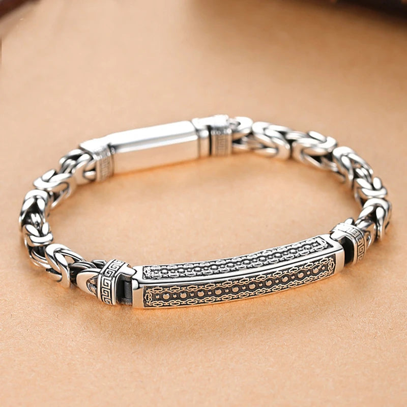 Silver-colored men's fashion bracelet from Corporación Turística, 22 cm long, stylish jewelry accessory.