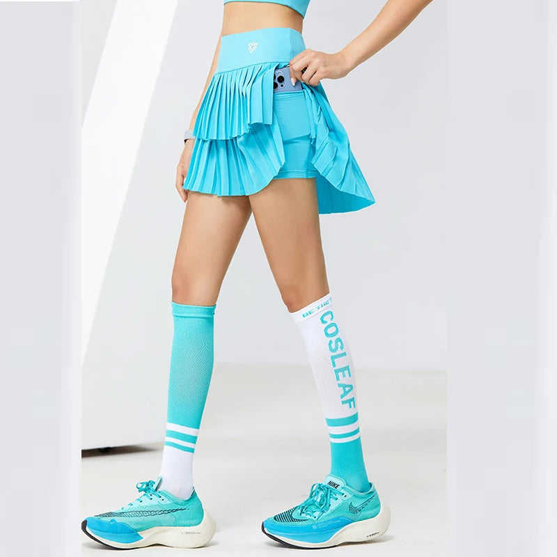 Mint green women's sporty pleated tennis miniskirt from Corporación Turística, featuring a comfortable athletic design.