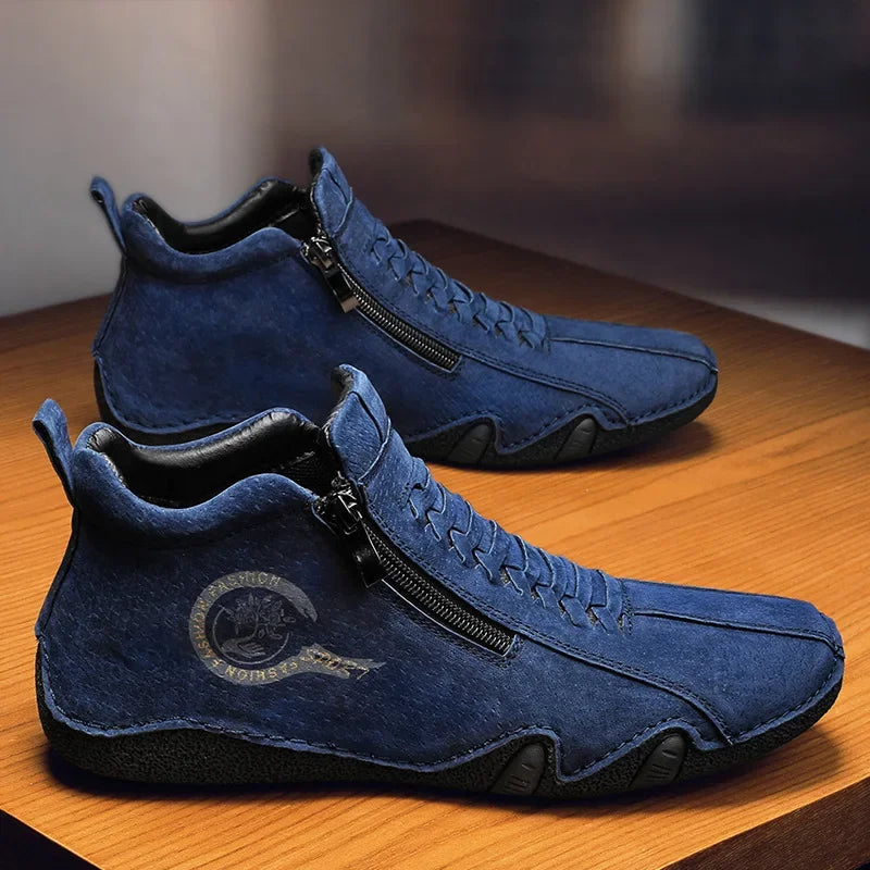 Sand-colored men's designer boots from 2025 collection by Corporación Turística, featuring sleek leather upper and stylish design.