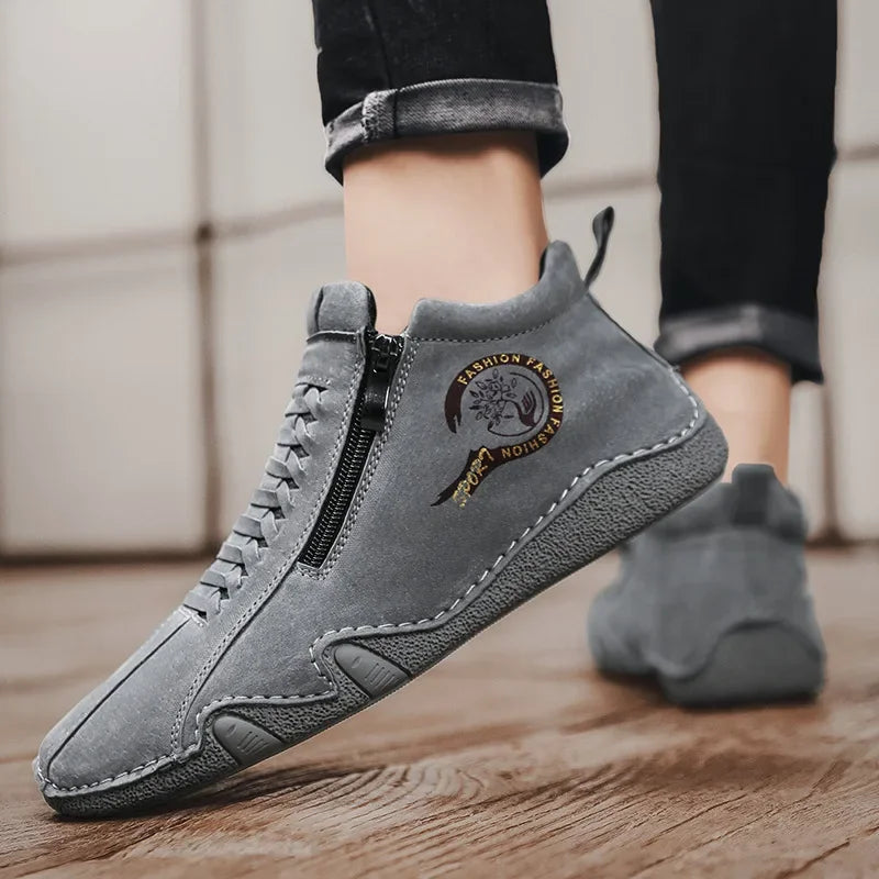 Sand-colored men's designer boots from 2025 with sleek leather design, featuring laces and a modern stylish look.