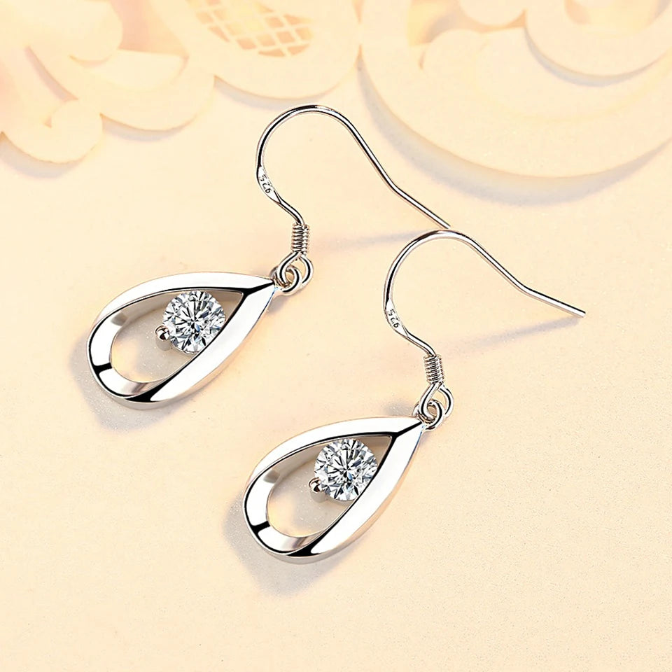 Water drop zircon earrings for women, silver-tone dangling earrings with sparkling crystal accents, elegant jewelry accessory.
