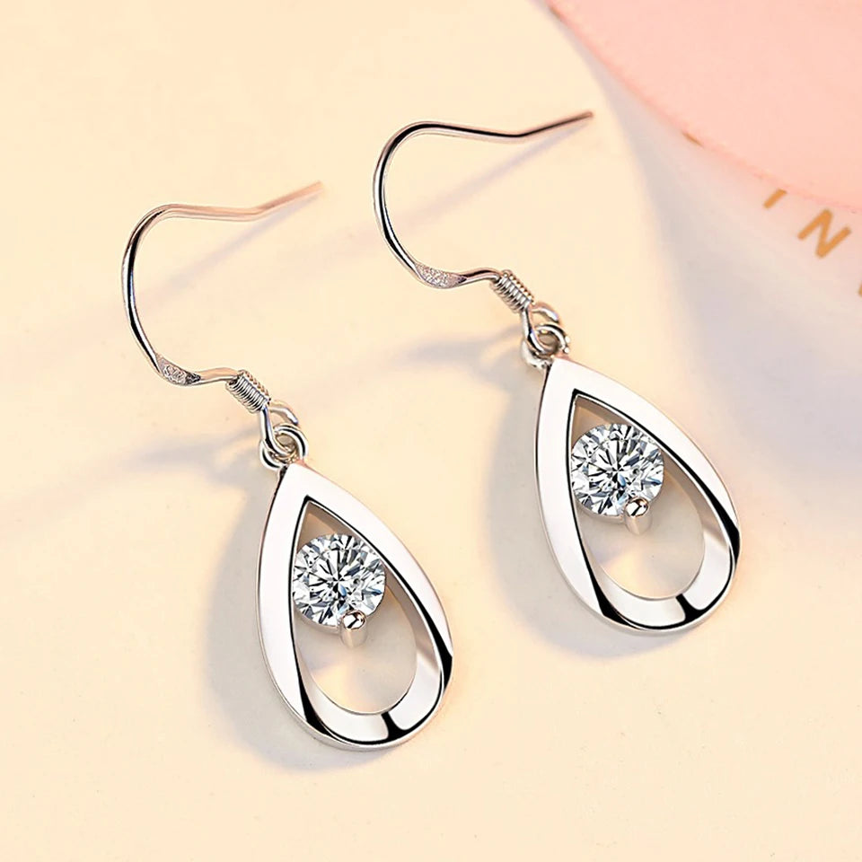 Elegant water drop zircon earrings for women, featuring sparkling gemstone pendants in silver-tone metal.