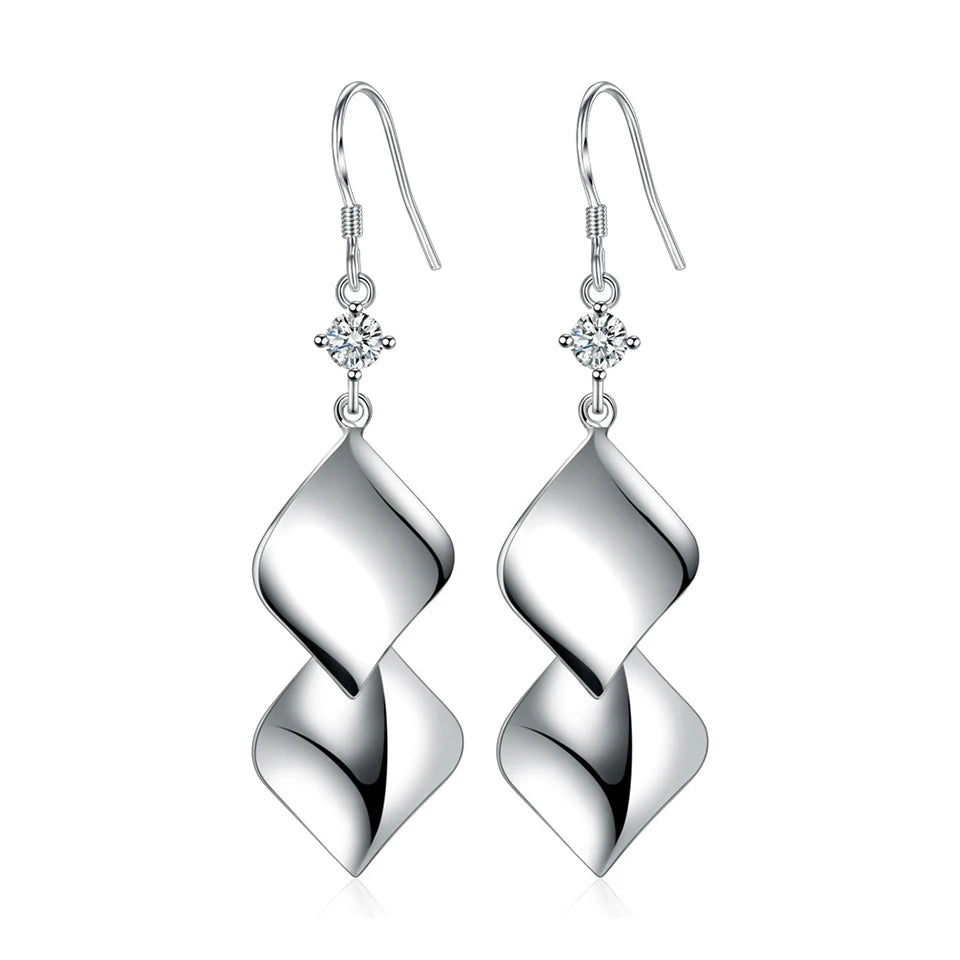 Water drop zircon earrings for women, silver-tone drop dangle earrings with sparkling stones, stylish jewelry by Corporación Turística
