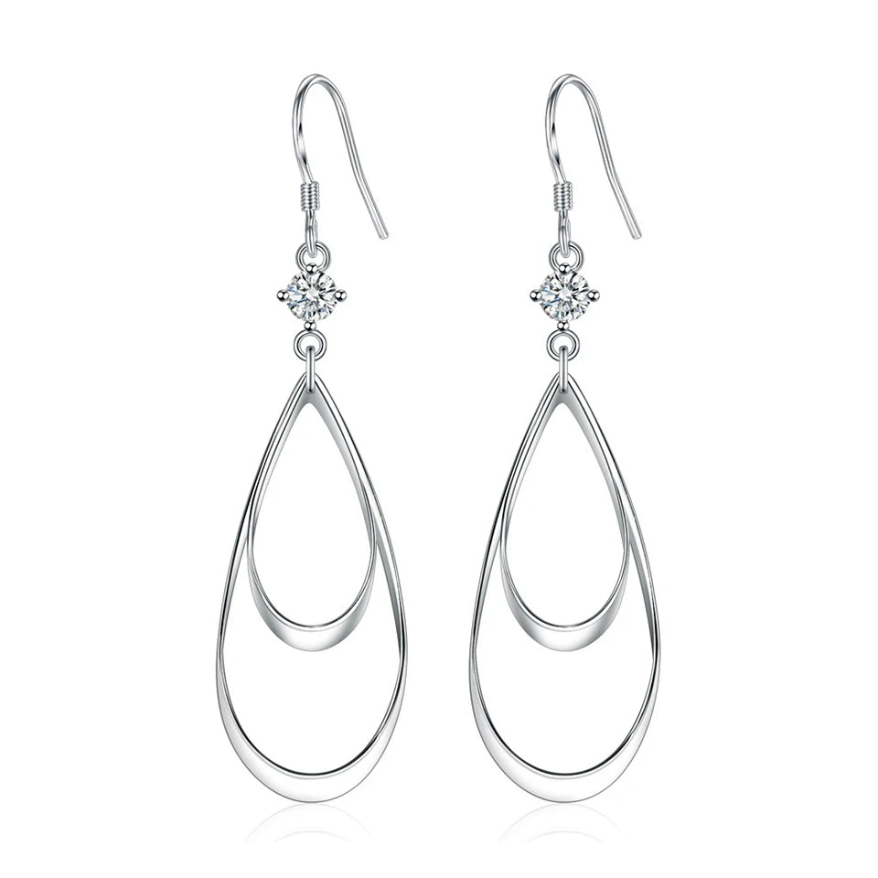 Water drop-shaped zircon earrings for women featuring sparkling stones, designed by Corporación Turística.