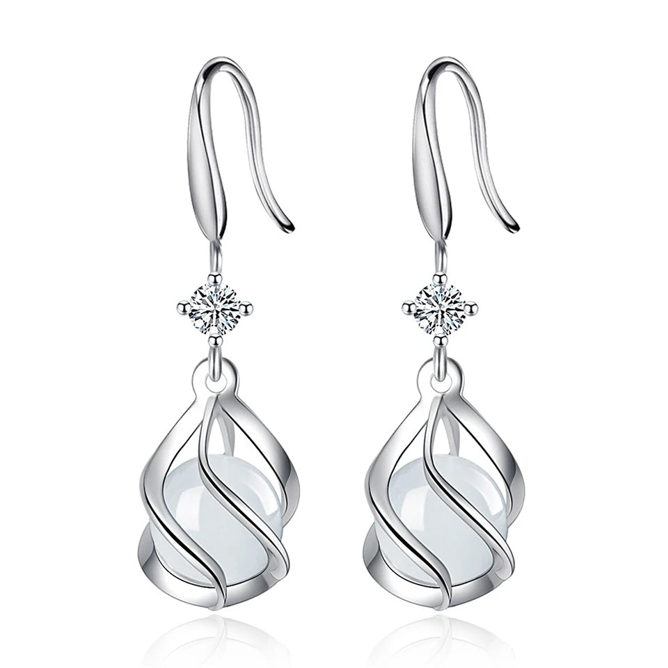 Water drop-shaped zircon earrings for women, silver-tone dangle jewelry with sparkling stones, stylish and elegant accessory.
