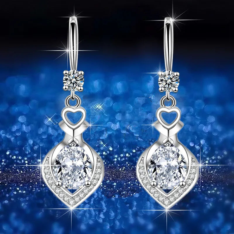 Elegant water drop-shaped zircon earrings for women, featuring sparkling gemstone details and silver-tone hooks.